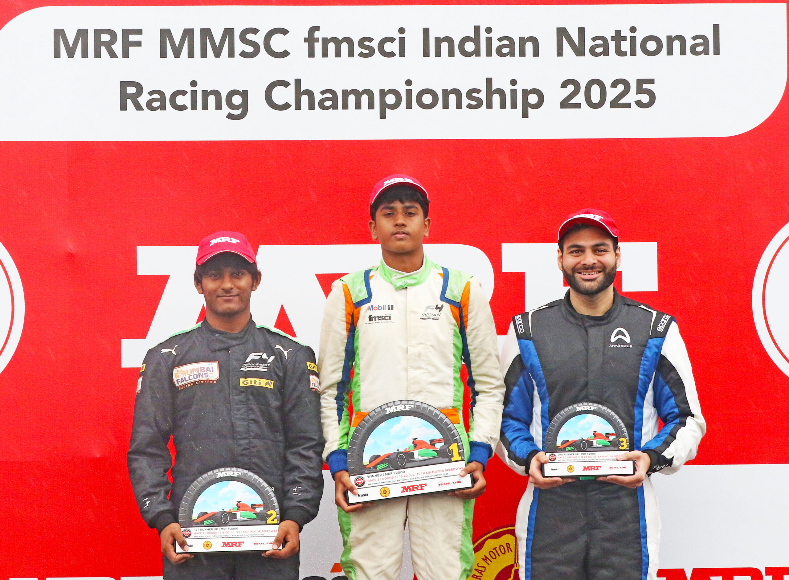 MRF F2000 Race-2 winner Ishaan Madesh (centre), flanked by second-placed Arjun Chheda (left) and third-placed Akhil Agarwal (July 20)