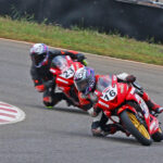 Raj Kumar (No.16), on way to winning the Super Stock 165cc race (Aug 02)