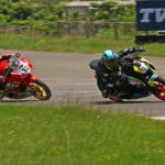 Mohamed Mikail (7) moves past Jagadeesh Nagaraj (32) to win the Stock 301-400cc (Novice) race (Sept 7)