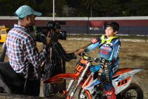 A junior rider talking to a local TV channel